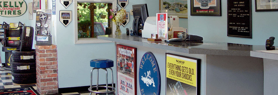 Checkout area and tire display section of Tony's Garage.