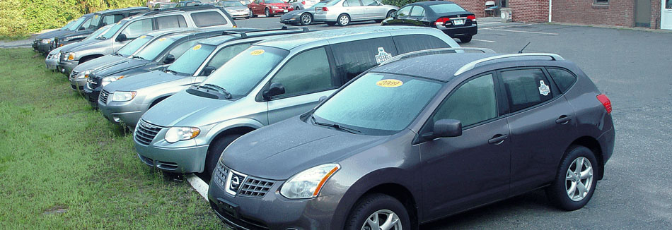 Row of cars for sale at Tony's Garage.